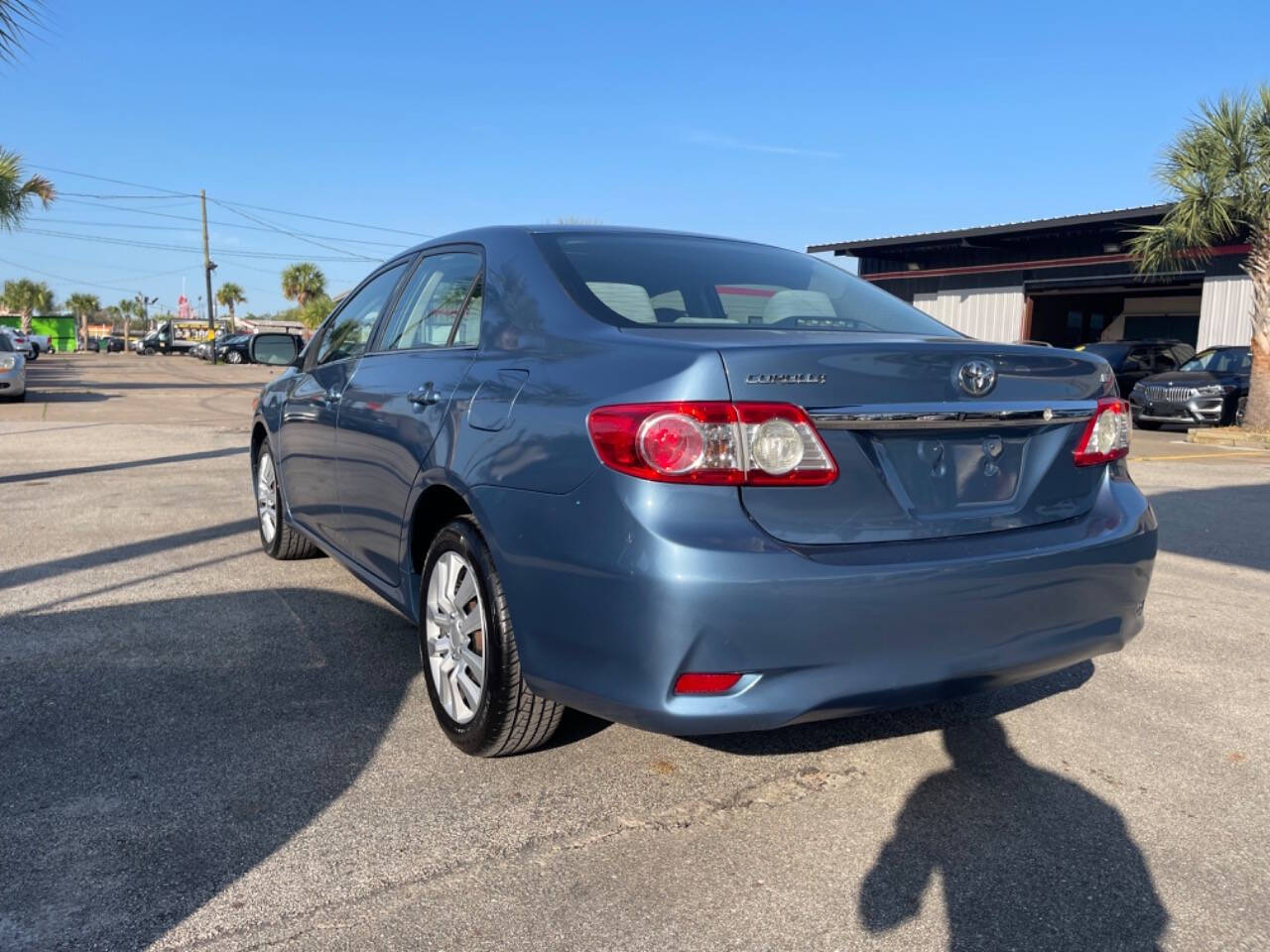 2013 Toyota Corolla for sale at SMART CHOICE AUTO in Pasadena, TX