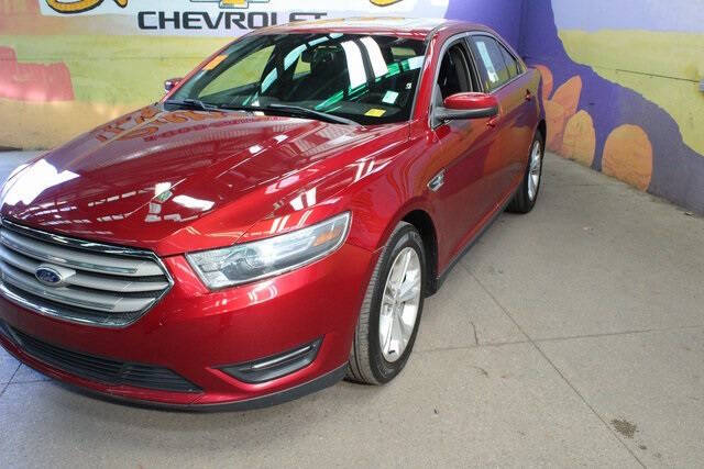 Used 2015 Ford Taurus SEL with VIN 1FAHP2E82FG157902 for sale in Grand Ledge, MI