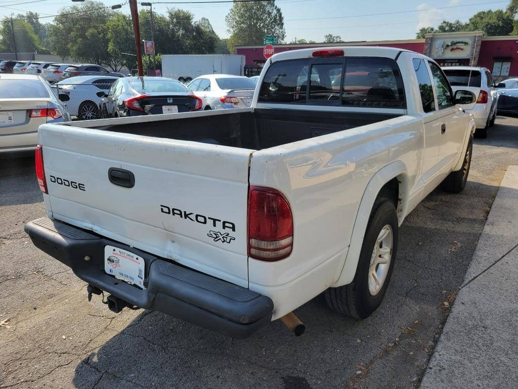 2004 Dodge Dakota for sale at DAGO'S AUTO SALES LLC in Dalton, GA