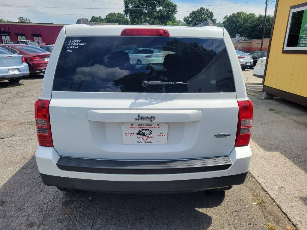 2014 Jeep Patriot for sale at DAGO'S AUTO SALES LLC in Dalton, GA