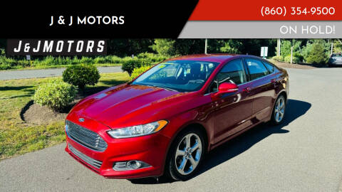 2014 Ford Fusion for sale at J & J MOTORS in New Milford CT