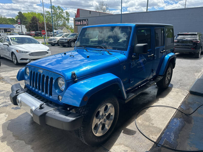 2015 Jeep Wrangler Unlimited for sale at Lee's Auto Sales in Garden City MI