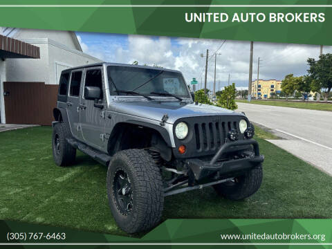 2013 Jeep Wrangler Unlimited for sale at UNITED AUTO BROKERS in Hollywood FL