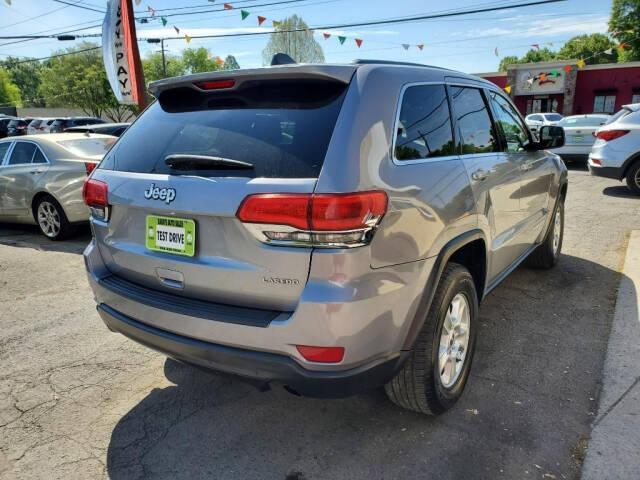 2014 Jeep Grand Cherokee for sale at DAGO'S AUTO SALES LLC in Dalton, GA