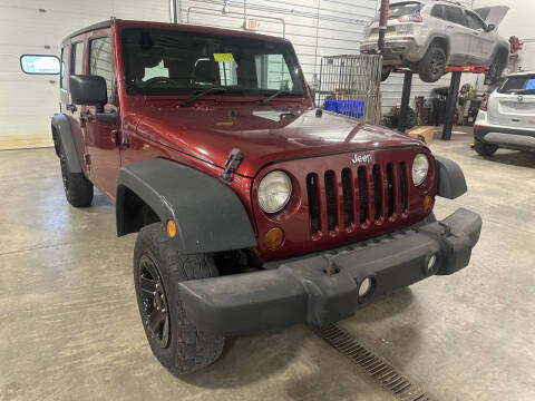 2013 Jeep Wrangler Unlimited for sale at Postal Pete in Galena IL