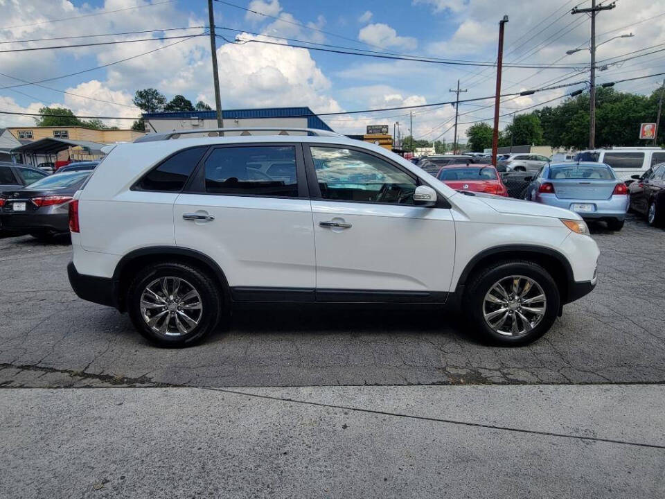 2011 Kia Sorento for sale at DAGO'S AUTO SALES LLC in Dalton, GA