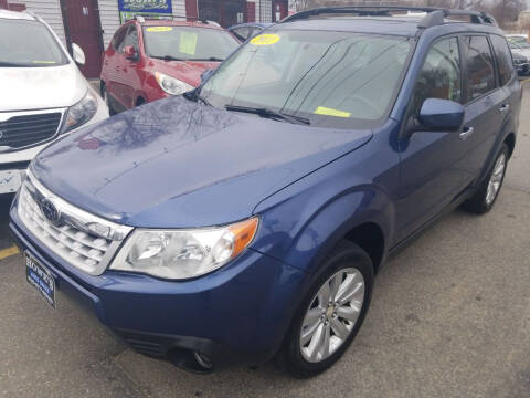 2011 Subaru Forester for sale at Howe's Auto Sales in Lowell MA