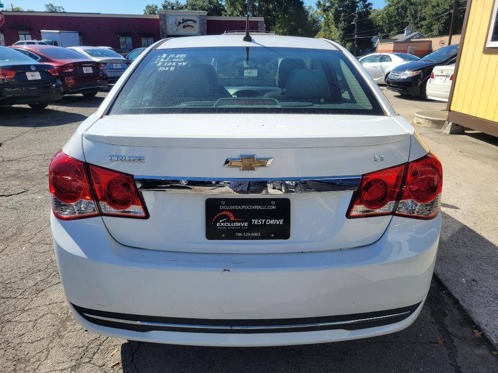 2013 Chevrolet Cruze for sale at DAGO'S AUTO SALES LLC in Dalton, GA