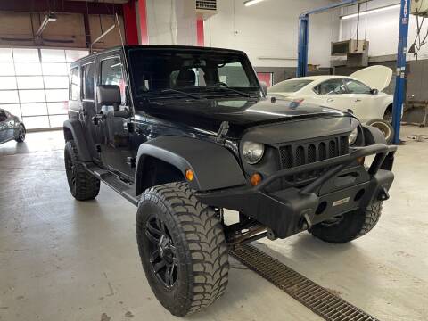 2013 Jeep Wrangler Unlimited for sale at Auto Solutions in Warr Acres OK