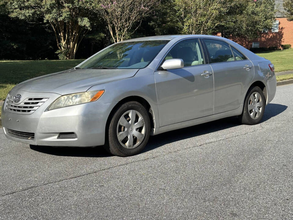 2009 Toyota Camry for sale at SHURE AUTO SALES in Snellville, GA