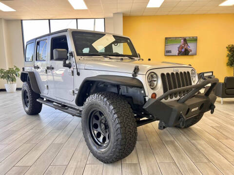 2012 Jeep Wrangler Unlimited for sale at Dixie Motors Inc. in Tuscaloosa AL