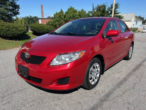 2010 Toyota Corolla for sale at D'Ambroise Auto Sales in Lowell MA