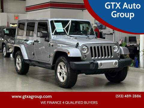 2015 Jeep Wrangler Unlimited for sale at GTX Auto Group in West Chester OH