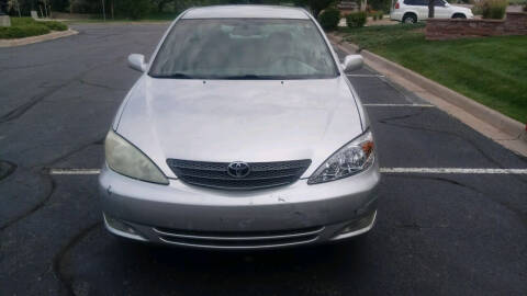 2004 Toyota Camry for sale at QUEST MOTORS in Englewood CO