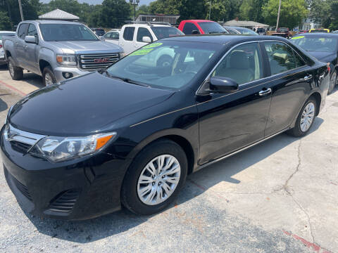 2014 Toyota Camry for sale at LAURINBURG AUTO SALES in Laurinburg NC