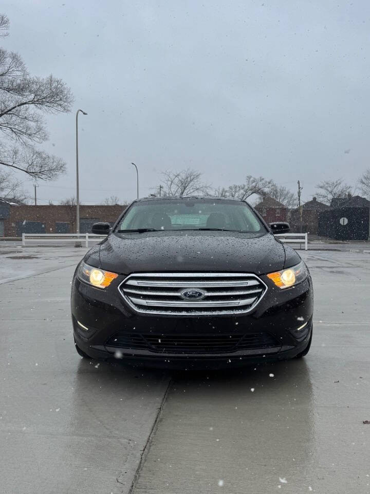 2014 Ford Taurus for sale at H & H AUTO GROUP in Detroit, MI