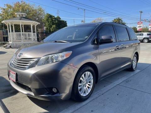 2014 Toyota Sienna for sale at Los Compadres Auto Sales in Riverside CA