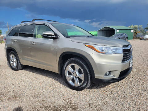 2014 Toyota Highlander for sale at BERKENKOTTER MOTORS in Brighton CO