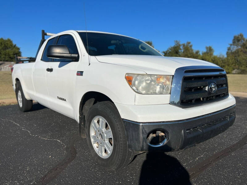 https://cdn05.carsforsale.com/70835f49bef700ea652688b90f2b6e66/800x600/2010-toyota-tundra-grade-4x4-4dr-double-cab-pickup-lb-5-7l-v8-ffv-.jpg