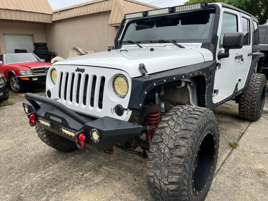 2013 Jeep Wrangler Unlimited for sale at Putnam Motors in Pomona Park, FL