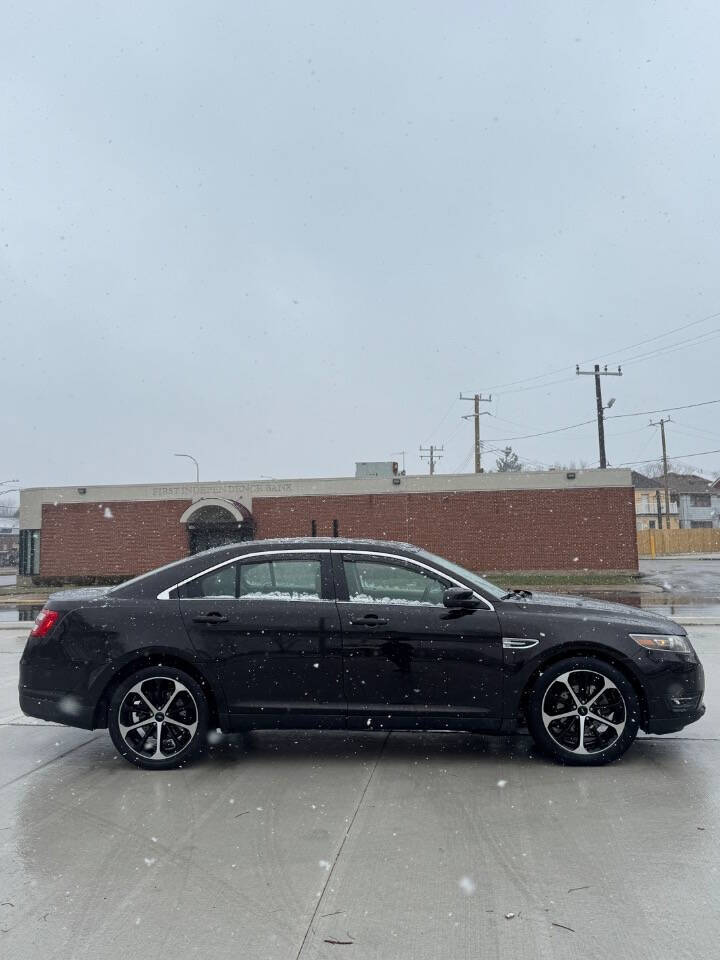 2014 Ford Taurus for sale at H & H AUTO GROUP in Detroit, MI