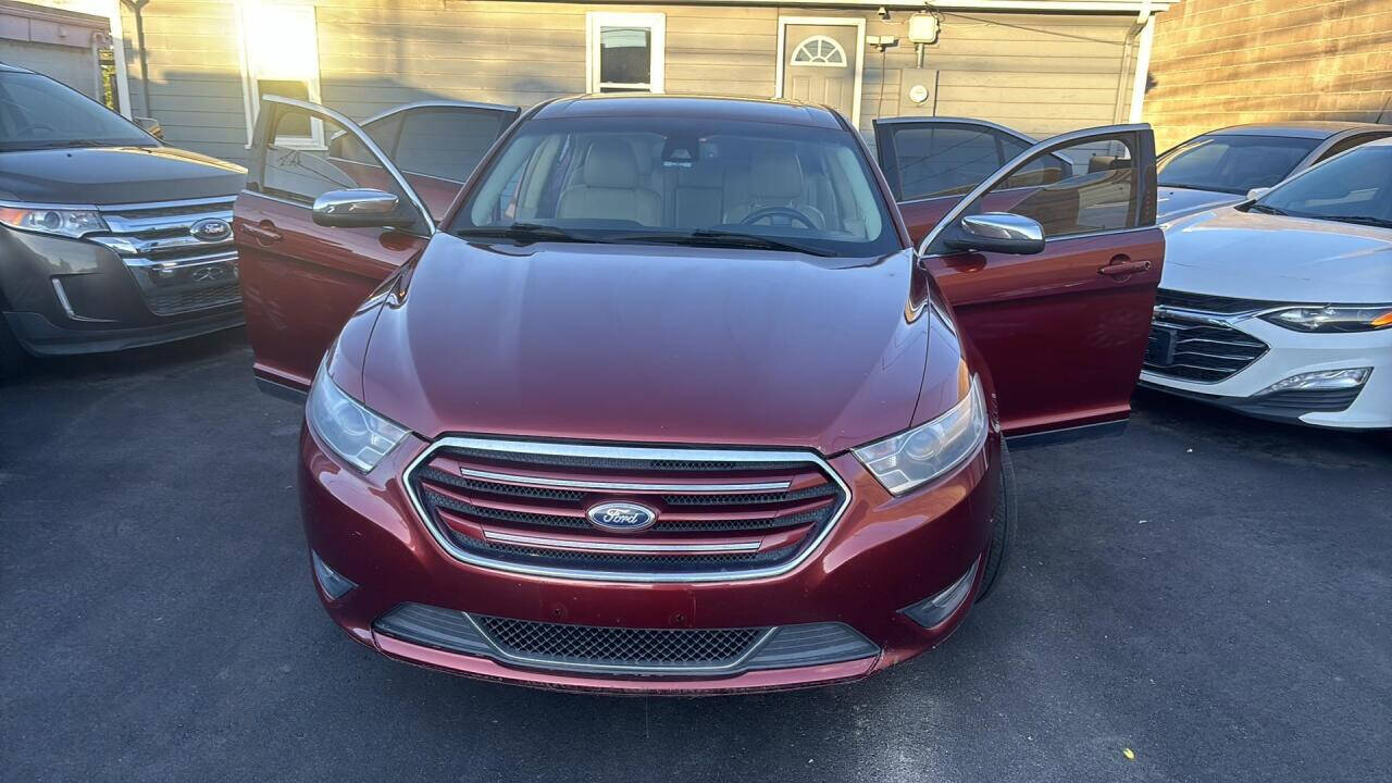 2014 Ford Taurus for sale at Ganda Auto Sales in Denver, CO