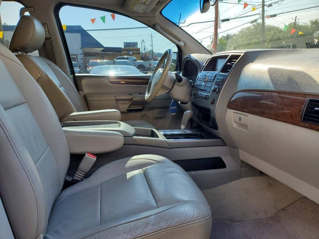 2010 Nissan Armada for sale at DAGO'S AUTO SALES LLC in Dalton, GA