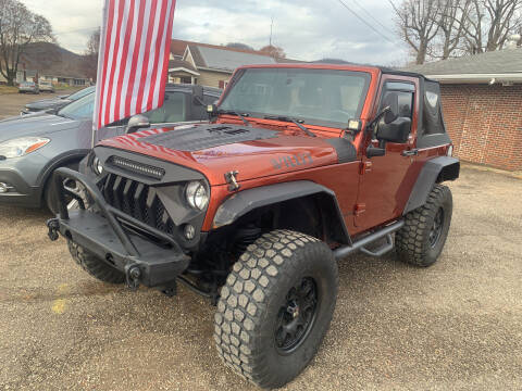 2014 Jeep Wrangler for sale at MYERS PRE OWNED AUTOS & POWERSPORTS in Paden City WV