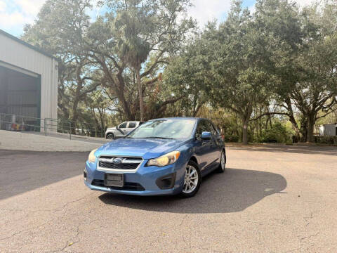 2014 Subaru Impreza for sale at Carnaval Auto Group LLC in Tampa FL