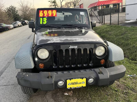 2011 Jeep Wrangler for sale at SCOTT HARRISON MOTOR CO in Houston TX