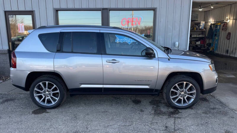 Used 2017 Jeep Compass Sport SE with VIN 1C4NJDBB1HD127210 for sale in La Crescent, Minnesota
