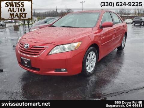 2009 Toyota Camry for sale at SWISS AUTO MART in Sugarcreek OH