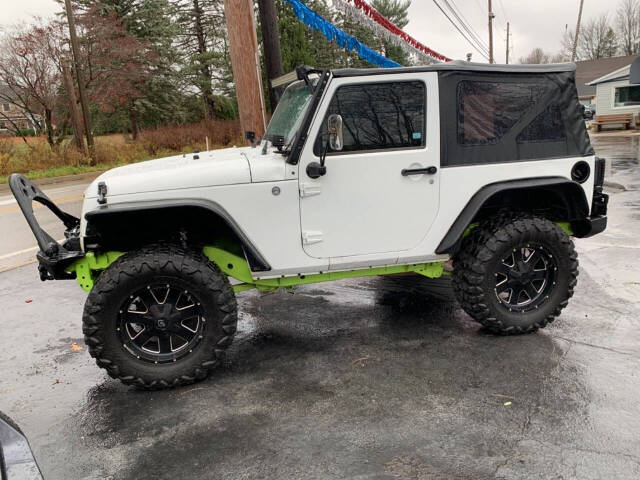 2013 Jeep Wrangler for sale at Chuckie Bizzarro's Fleetwing Auto in Erie, PA