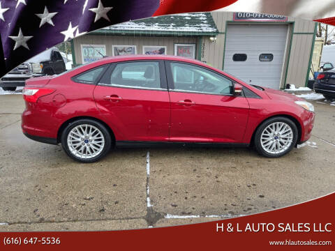 2014 Ford Focus for sale at H & L AUTO SALES LLC in Wyoming MI