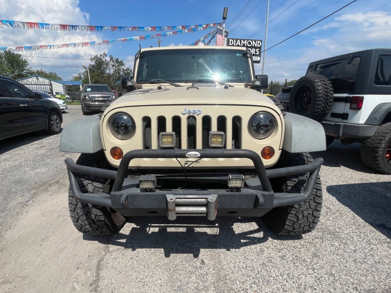 2011 Jeep Wrangler Unlimited for sale at DIAMOND MOTORS INC in Houston, TX