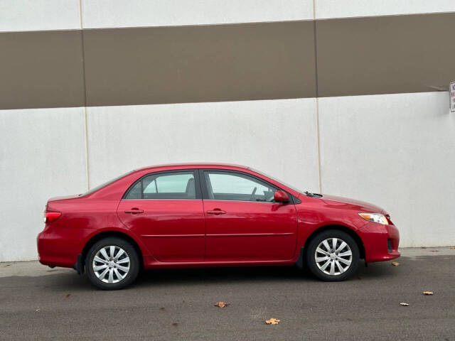 2013 Toyota Corolla for sale at Phoenix Motor Co in Romulus, MI