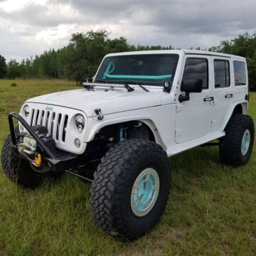 2016 Jeep Wrangler Unlimited for sale at Specialty Motors LLC in Land O Lakes FL