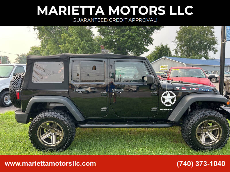 2015 Jeep Wrangler Unlimited for sale at MARIETTA MOTORS LLC in Marietta OH