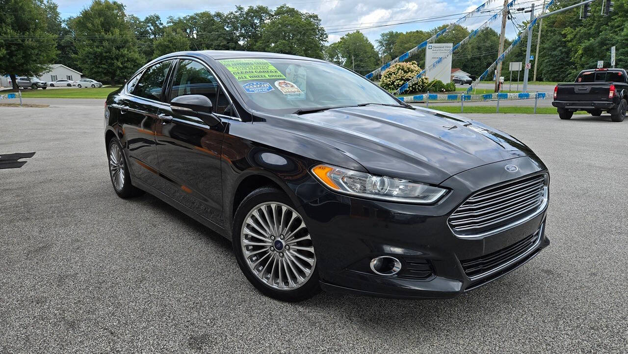 2014 Ford Fusion for sale at North Ridge Auto Center LLC in Madison, OH