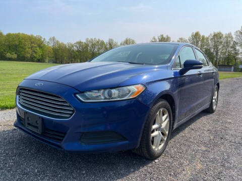 2013 Ford Fusion for sale at GOOD USED CARS INC in Ravenna OH