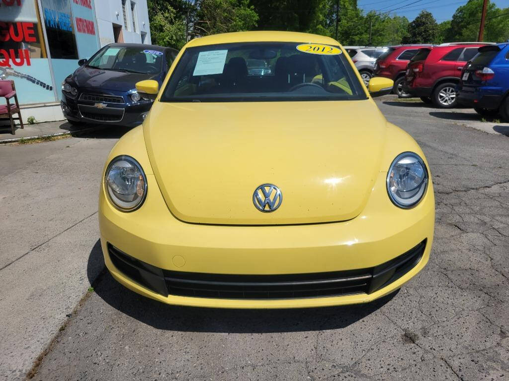 2012 Volkswagen Beetle for sale at DAGO'S AUTO SALES LLC in Dalton, GA