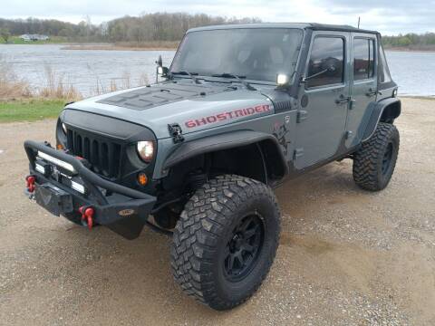 2014 Jeep Wrangler Unlimited for sale at Rombaugh's Auto Sales in Battle Creek MI
