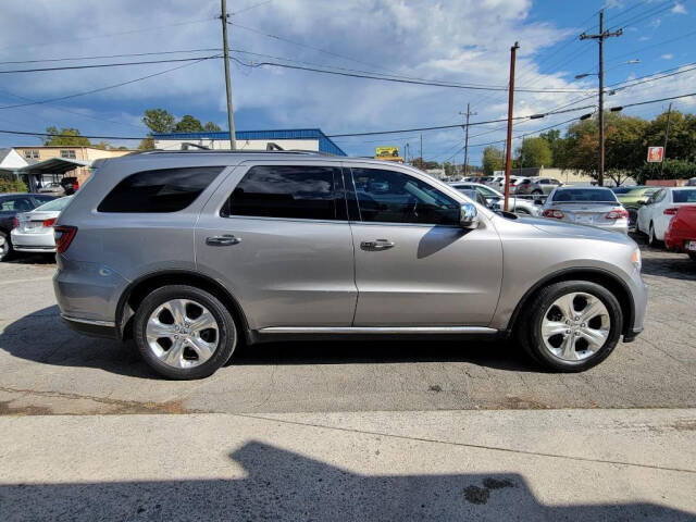 2014 Dodge Durango for sale at DAGO'S AUTO SALES LLC in Dalton, GA