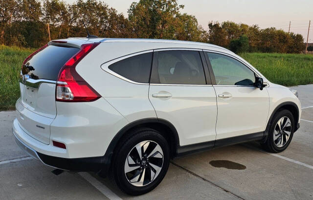 2015 Honda CR-V for sale at CAR MARKET AUTO GROUP in Sugar Land, TX