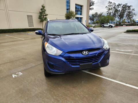 2012 Hyundai Tucson for sale at E and M Auto Sales in Bloomington CA