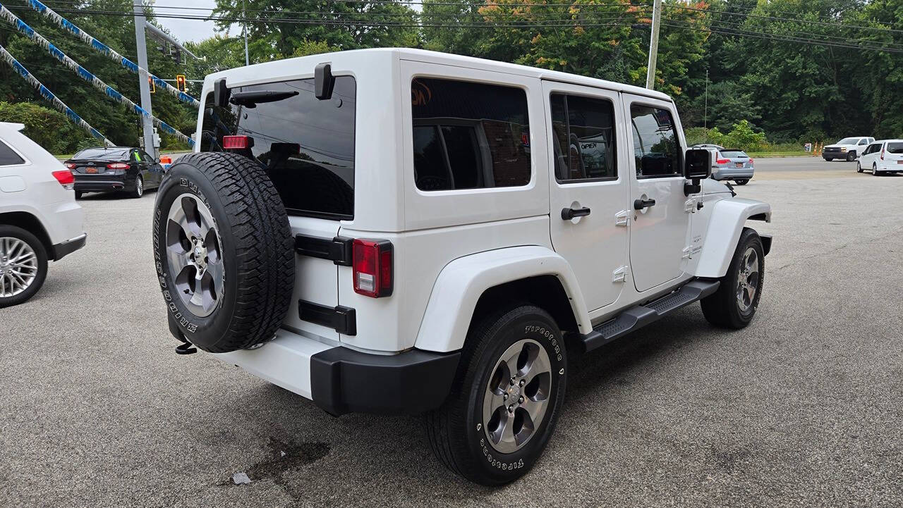 2016 Jeep Wrangler Unlimited for sale at North Ridge Auto Center LLC in Madison, OH