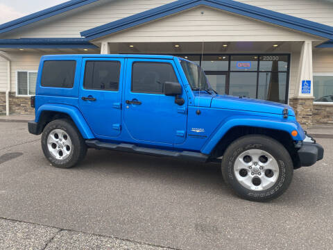 2014 Jeep Wrangler Unlimited for sale at The Car Buying Center in Saint Louis Park MN