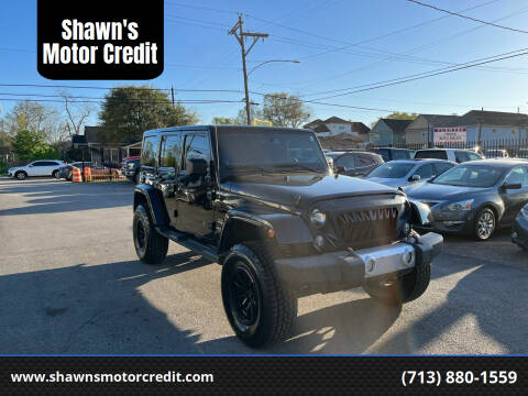 2014 Jeep Wrangler Unlimited for sale at Shawn's Motor Credit in Houston TX