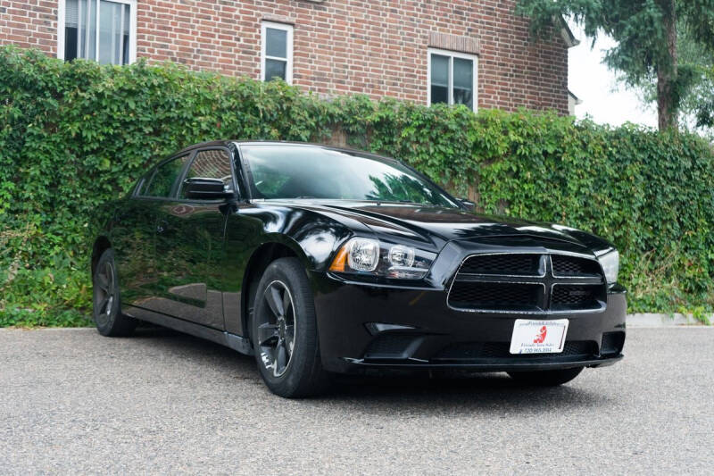 2014 Dodge Charger for sale at Friends Auto Sales in Denver CO