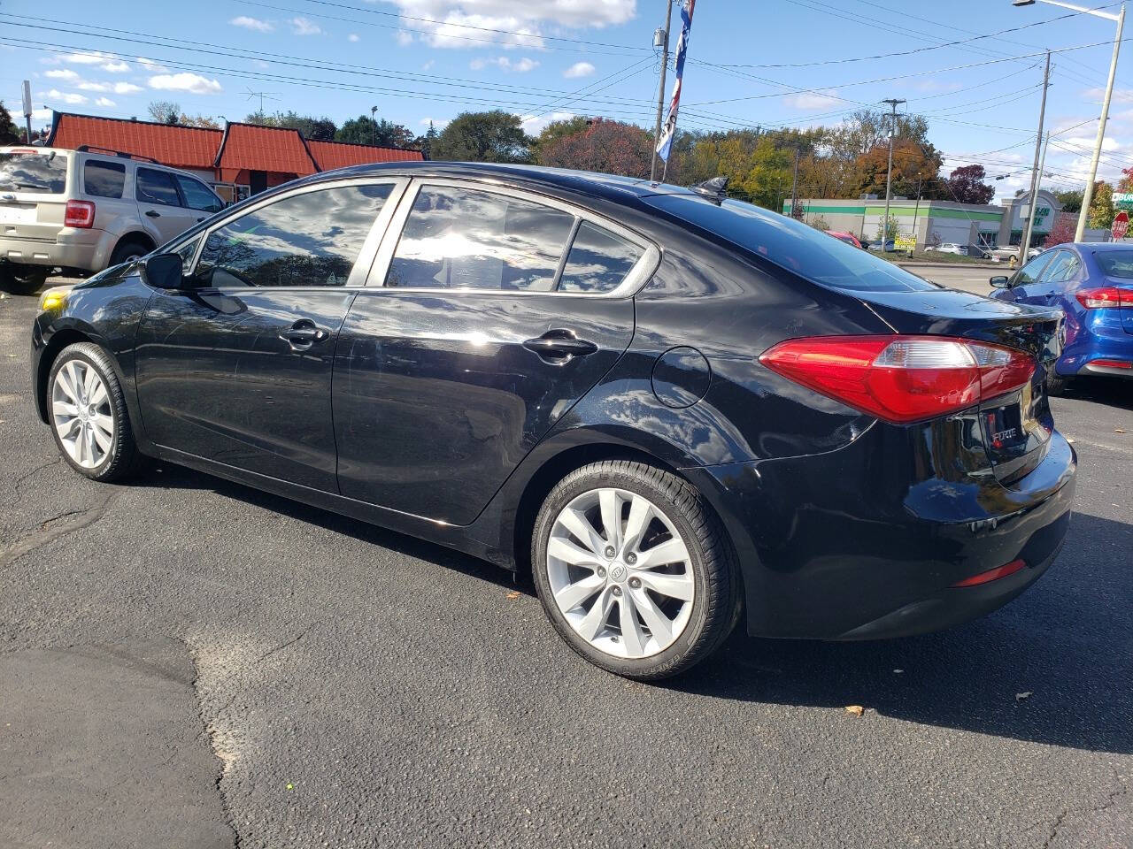 2016 Kia Forte for sale at Auto Shop in Wyoming, MI